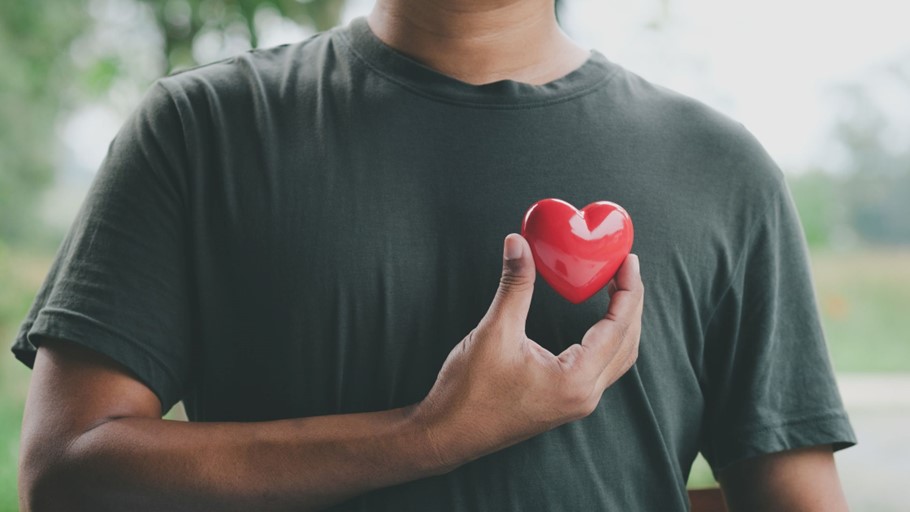 a man holding a heart
