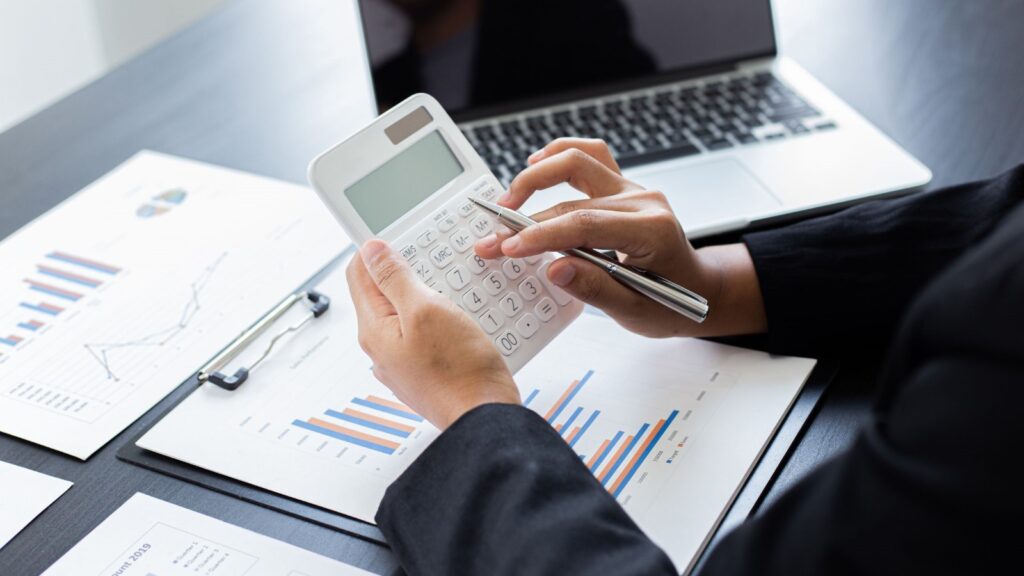 A Person Using a Calculator