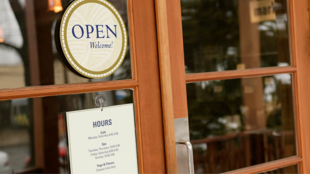 A close-up of a sign on a door — Boosting Small Business
