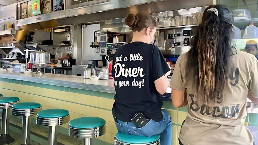 Two women sitting at a bar