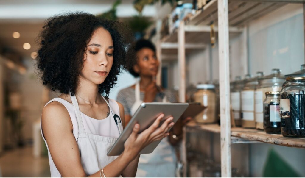 Business Owner Looking at the Tablet